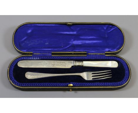 A cased silver knife and fork, the knife having engraved detail to the blade, assayed Sheffield 1897 and 1900, gross weight 7