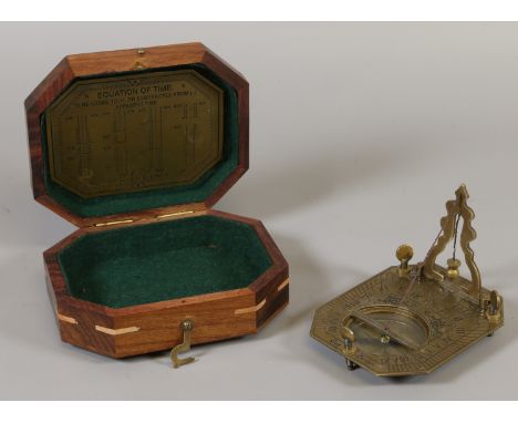 A cased reproduction sundial/compass.