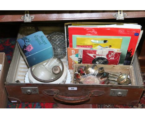 A vintage suitcase and contents of miscellaneous including cut glass, Stuart crystal, L.P records, silver plate cutlery, Roya