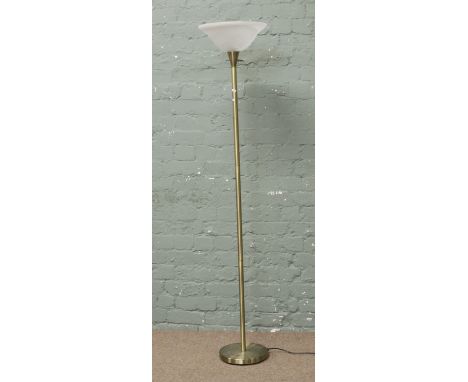 A C20th brass standard lamp with frosted glass uplighter.