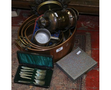 A collection of metalwares to include copper pans, painted iron trivets, oil lamp and barometer and cutlery in cases.