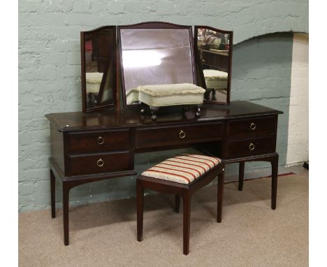 A Stag Minstrel dressing table, stool and another stool.