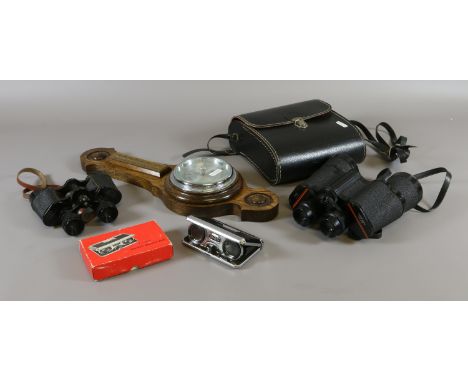 A pair of cased Prinz binoculars 10x50 Denhill 8 x 25 binoculars, boxed pocket binoculars and an oak cased barometer.
