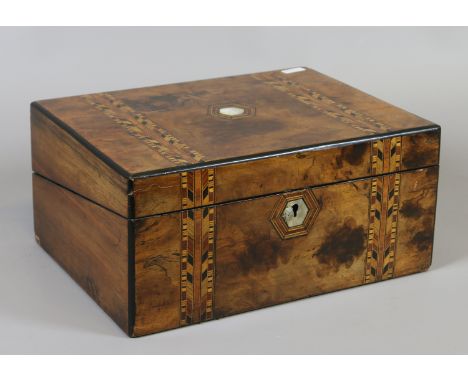 A Victorian inlaid burr walnut writing slope with mother of pearl lozenge and fitted interior.