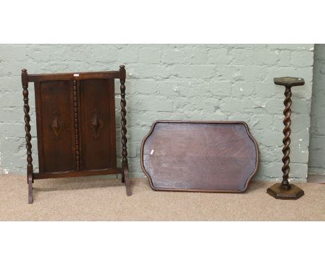 A carved oak barleytwist fire screen and smokers stand, along with an oak tray.
