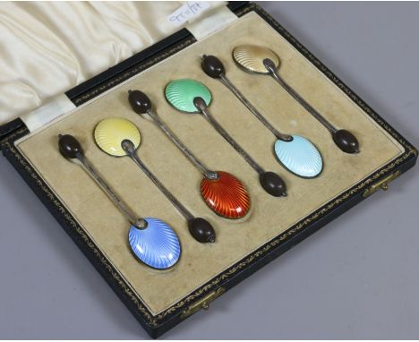 A cased set of six silver demitasse spoons with coffee bean shaped terminals and coloured enamel bowls, assayed Birmingham 19