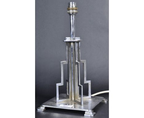 A retro vintage early 20th Century Art Deco chrome table lamp light base. The lamp of stepped four section form and raised on