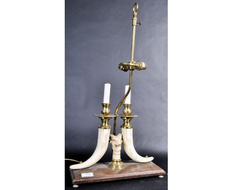 A vintage mid 20th Century antique style twin light table / desk lamp light of brass and resin construction. The lamp having 