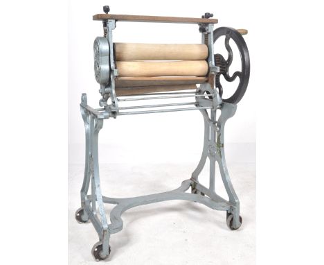 A vintage early 20th Century CAS&nbsp;wrought iron and wooden mangle shop display / garden feature. Finished in blue with all