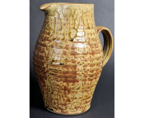Michael Leach&nbsp;(1913-1985) - A mid 20th Century studio art pottery jug of typical form having a glazed mottled finish wit