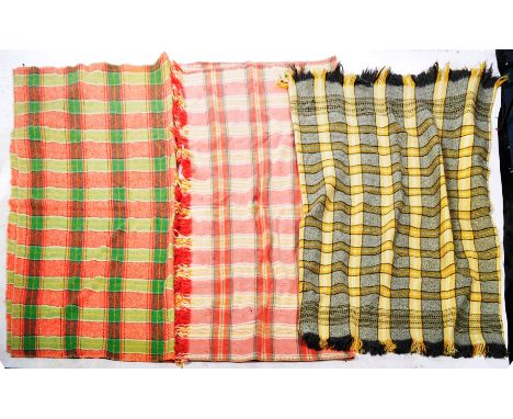 A collection of three large vintage mid 20th Century woollen Welsh blankets. One blanket having a yellow background with blac
