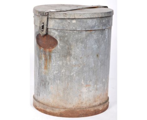 A retro vintage mid 20th Century galvanised bin of cylindrical form with a hinged cover atop and cast iron plaque to the fron