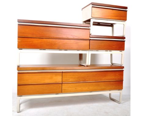 A retro vintage 20th Century teak wood bedroom suite comprising a pair of single drawer bedside cabinets raised on shaped qua