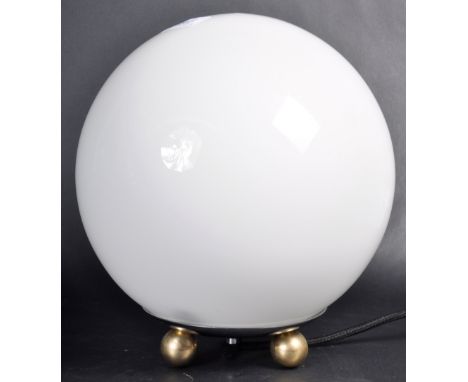 A retro vintage 1930's Art Deco globe table light light comprising of a ball shaped opaline glass shade raised on three ball 