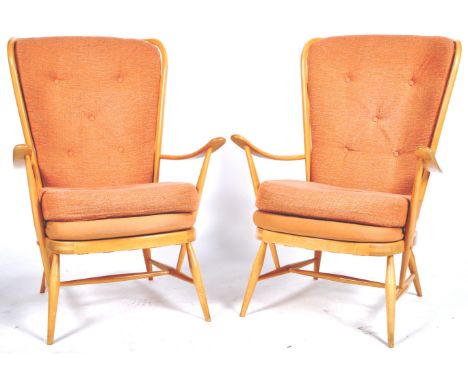 Lucian Ercolani - Ercol - A matching pair of retro vintage 20th Century high back wingback armchairs / easy lounge chairs. Ea