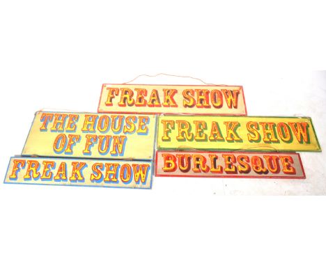 A collection of five retro vintage early - mid 20th Century circus fairground attraction sideshow signs. Wooden construction 