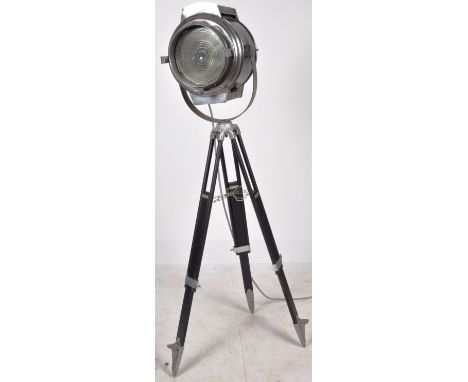 A vintage 20th Century Aluminium mercury ship's flood lamp being raised on&nbsp;an adjustable ebonised tripod base united by 