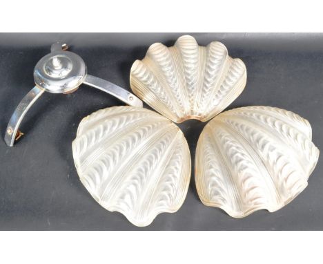 A retro vintage early 20th Century Art Deco ceiling light lamp fixture comprising of three clam shell pulled glass shades sur