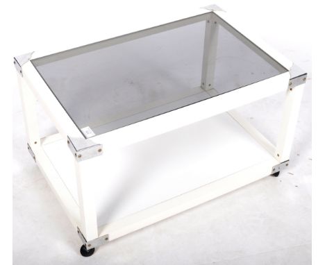 A retro vintage late 20th Century glass coffee table in the manner of Merrow Associates. The occasional table having an inset