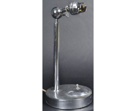 A retro vintage mid 20th Century Art Deco chrome table desk lamp having an adjustable bulb holder with tubular chrome columns