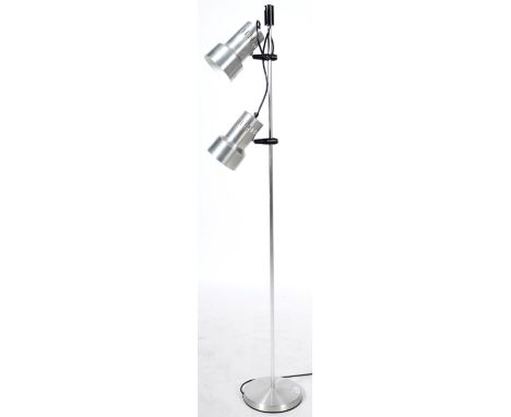 An original retro vintage 1970's floor standing twin spot lamp light having stainless steel cylindrical shades supported by a