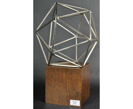 A contemporary retro vintage modern art British studio sculpture. The statue of metal construction consisting of interlocking