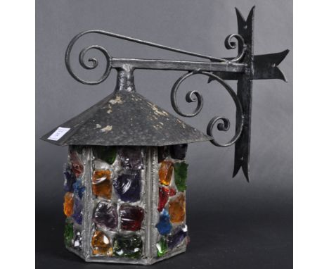 Peter Marsh - A retro vintage 20th Century Arts &amp; Crafts wrought iron porch lantern. The light / lamp having multiple col