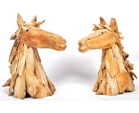 A large pair of retro vintage 20th Century sculptural models of horses head. Each horse head constructed from various pieces 