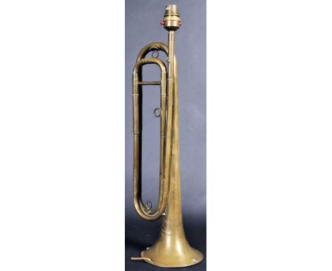 A retro vintage 20th Century French upcycled lamp light converted from a brass trumpet of typical form. The mouthpiece top fo