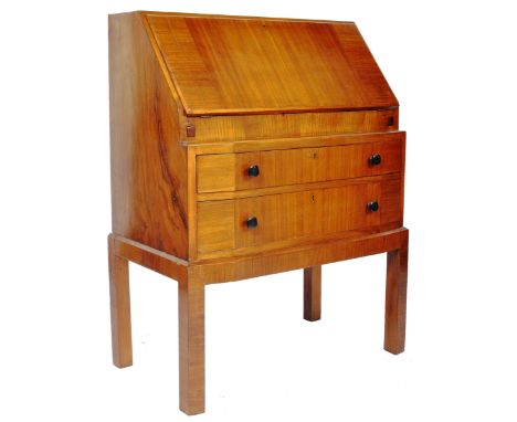 A vintage 20th Century 1930's Art Deco walnut veneered bureau desk having a full front top opening to reveal a fitted interio