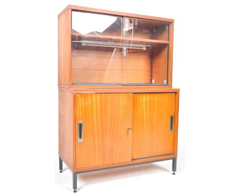 Manner of Florence Knoll - A 20th Century retro vintage teak wood sliding cabinet sideboard credenza. Comprises two sliding c