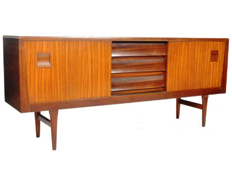 Elliotts Of Newbury - EON - An original retro vintage 1960's teak wood sideboard credenza comprising of a central bank of dra