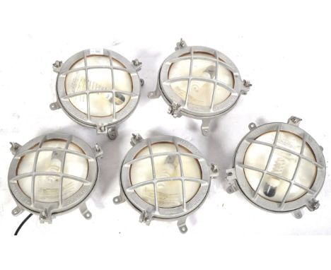 A set of five retro vintage 21st Century American industrial ships bulkhead wall light / lamp fixtures. The lights of circula