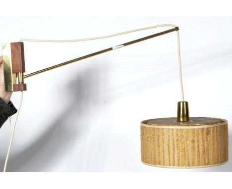 An original retro vintage 1960's Danish teak wood and brass wall light lamp fixture. Comprises a teak wall mount with adjusta