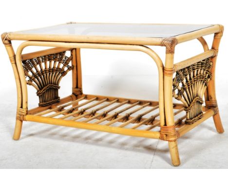 A retro vintage 20th Century 1980's bamboo and cane coffee / occasional table having an inset smokie glass panel with slated 