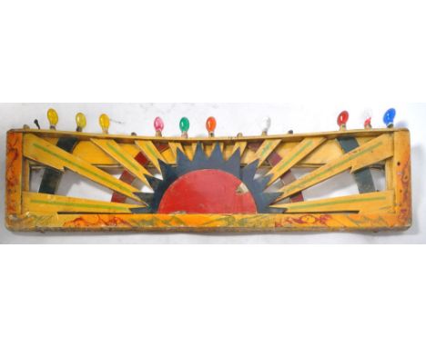 A vintage mid 20th Century 1940's / 50's fairground / funfair hand painted panel having sunburst decoration with a series of 