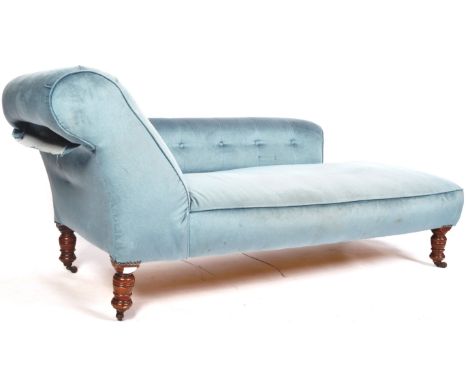 A 19th Century Victorian Chesterfield manner Chaise Lounge sofa daybed having blue upholstery finish. Buttoned back and angle