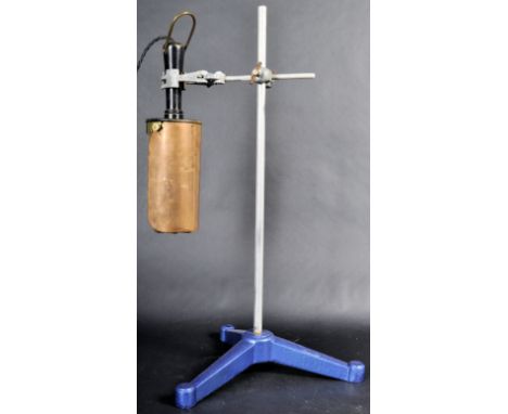 A retro vintage mid 20th Century copper and brass industrial inspection lamp having a copper panel back with brass cage to th