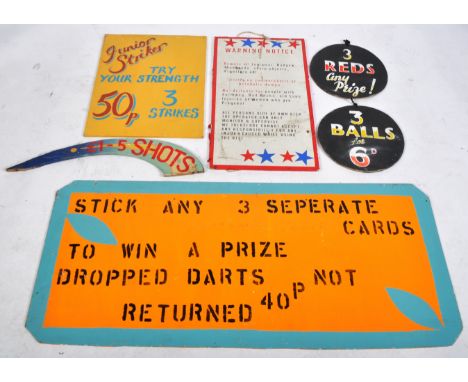 A selection of vintage 20th Century fairground / funfair signage for various activities to include '£1 - 5 Shots', Junior Sti
