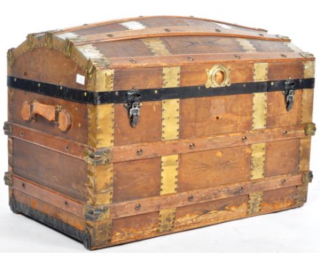 A 19th Century Victorian brass and leather bound trunk steamer chest having a domed lid with detailed leather finish and bras