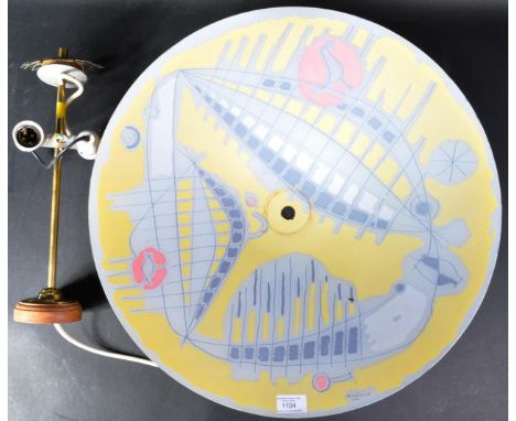 A large retro mid 20th Century hanging glass ceiling light shade of disc form having a yellow and white painted ground with b