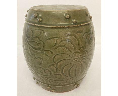 A small Chinese ceramic, celadon glazed barrel seat with studded detail and floral decoration.   Approx. 21cm tall x 17cm dia