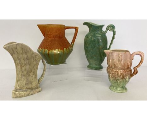 A collection of 4 Art Deco pottery jugs to include Carlton Ware, Crown Derby &amp; Falcon Ware.  2 pieces have small chips.  