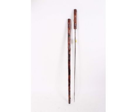 Regency sword stick with triangular section tapered blade with traces of blued and gilt decoration with bamboo handle and sha