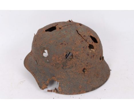 Second World War Nazi M40 Pattern Steel helmet in ‘relic’ condition, believed to have been recovered from Latvia