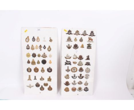 Two boards of British Military cap badges to include Durham Light Infantry, Royal Army Medical Corps and Royal Corps of Signa