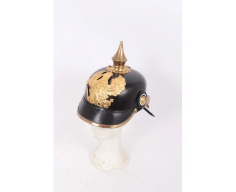 Reproduction Imperial German Picklehaube helmet of leather construction with gilt eagle badge