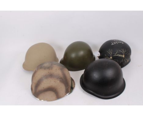 Group of various military helmets to include American M1 style helmet, Danish M39 helmet, Chinese steel helmet, Egyptian stee