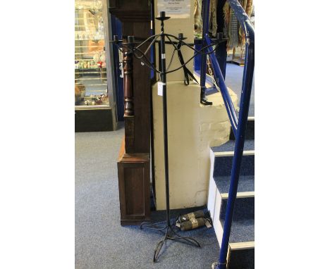 Wrought metal standard candle lamp with five sconces and quatrefoil base.