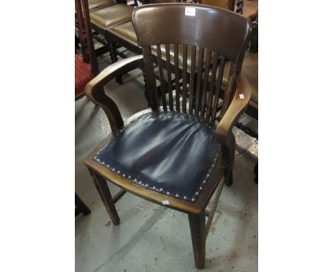 20th Century stained office armchair. 